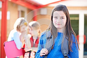 Unhappy Girl Being Gossiped About By School Friends