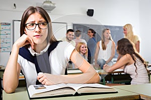 Unhappy girl in college classroom