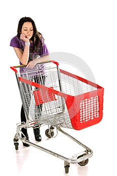 Unhappy girl with shopping cart