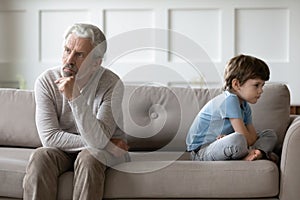 Unhappy grandfather and small grandson have fight