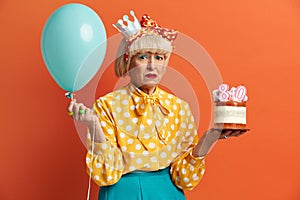 Unhappy Grandmother Celebrating Birthday. Dissatisfied Lady Grumpy Expression