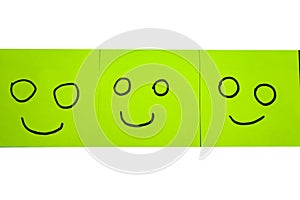 Unhappy and happy concept. Background of sticky notes. Green sticky note is among yellow sticky notes