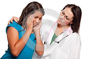 Unhappy Hispanic Girl and Concerned Female Doctor