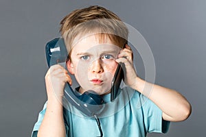Unhappy kid listening to two voices for burnout communication concept photo