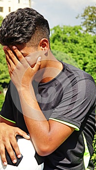 Unhappy Latino Male Soccer Player