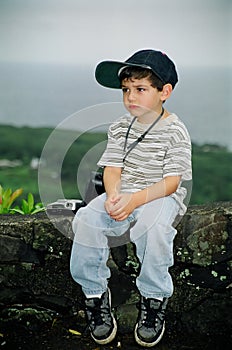 Unhappy Little Boy with Camera