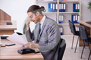 Unhappy male businessman in the office