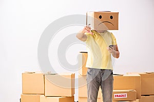 The unhappy man with box instead of his head