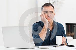 Unhappy Man At The Desk