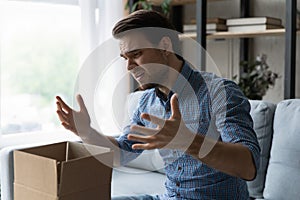 Unhappy man frustrated by wrong order, bad delivery service