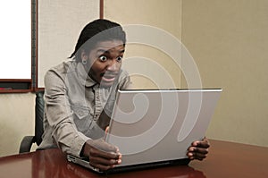 Unhappy man looking at a laptop