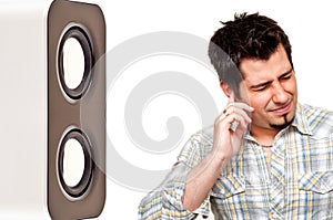Unhappy man pluging his ear