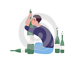 Unhappy man sitting on floor and hugging bottle.Young guy with alcohol addiction isolated on white background. Alcoholic