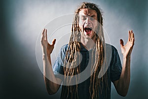 Unhappy man on a solid background
