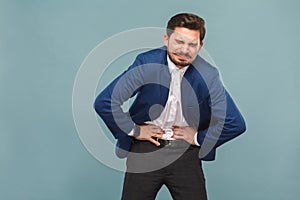 Unhappy man with stomach spasm