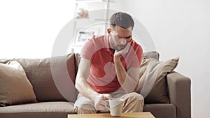 Unhappy man suffering toothache at home