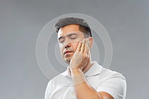 Unhappy man suffering toothache