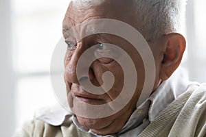 Unhappy mature grandpa suffering from psychological problems.