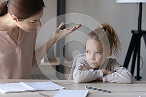 Unhappy mom scold lazy unmotivated daughter studying