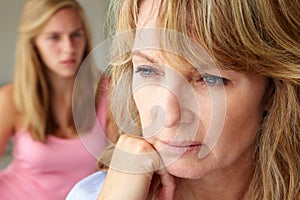 Unhappy mother with teenage girl photo