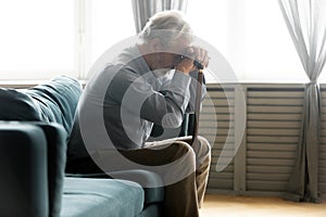 Unhappy old man with cane feel lonely at home