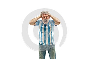The unhappy and sad Argentinean fan on white background