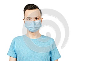 Unhappy, sad young man wearing a protective face mask prevent virus infection or pollution on white isolated background