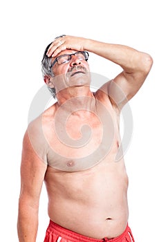 Unhappy senior man with headache