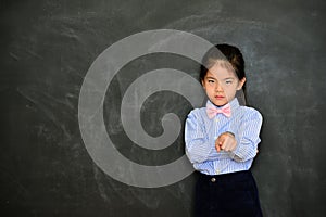 Unhappy seriously girl kid teacher blames student