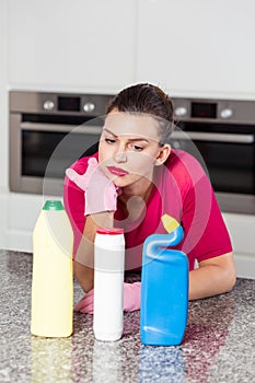 Unhappy single woman doing housework