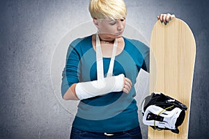 Unhappy snowboarder with broken arm