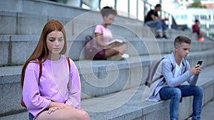 Unhappy teen female suffering from loneliness, lack of friends, unrequited love