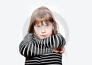 Unhappy teen girl with crossed hands