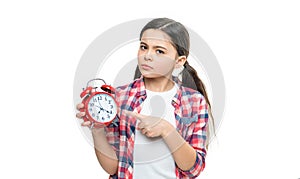 unhappy teen girl with deadline alarm on background. photo of teen girl with deadline alarm clock