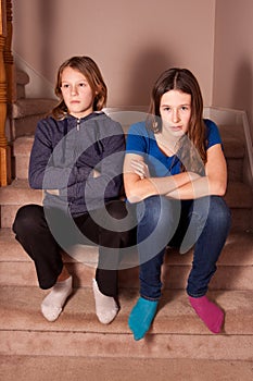 Unhappy teenage sisters