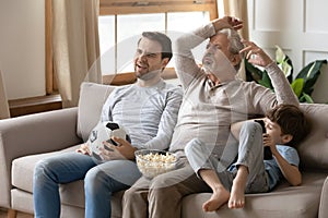 Unhappy three generations of men distressed with game result