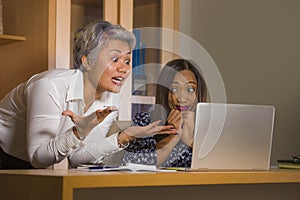 Upset business woman nagging and scolding on employee girl angry for computer mistake in office boss or chief authority and