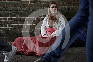 Vulnerable Homeless Teenage Girl Sleeping On The Street photo