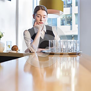 Unhappy waitress at work