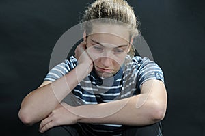 Unhappy weeping teenager girl feels lonely