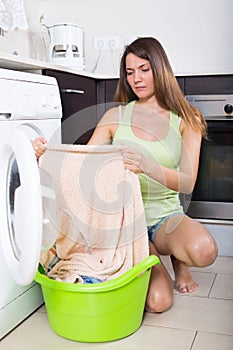 Unhappy woman cheking clothes
