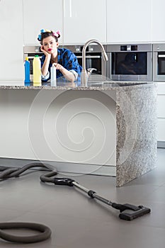 Unhappy woman cleaning house