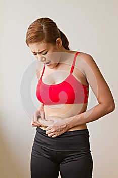 Unhappy woman with excessive fat at her waist