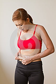 Unhappy woman with excessive fat at her waist photo