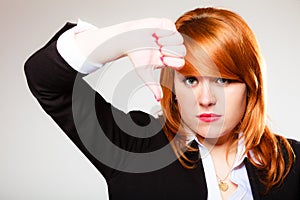 Unhappy woman giving thumb down gesture