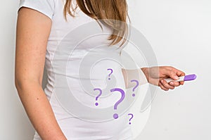 Woman with imagination of a pregnant belly - infertility concept photo