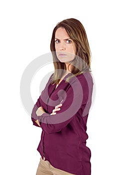 Unhappy woman looking at camera with arm crossed