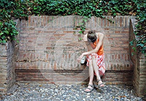 Unhappy woman in orange