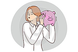 Unhappy woman with piggybank stressed with finances
