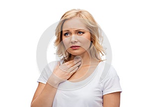 Unhappy woman suffering from throat pain
